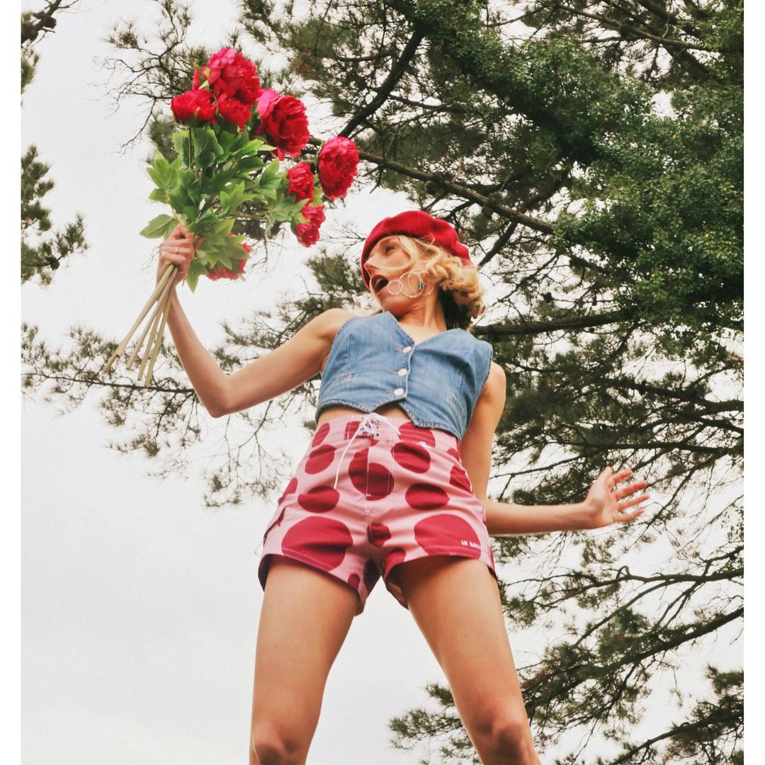 La Reina Pink Olé Boardshort — lifestyle view